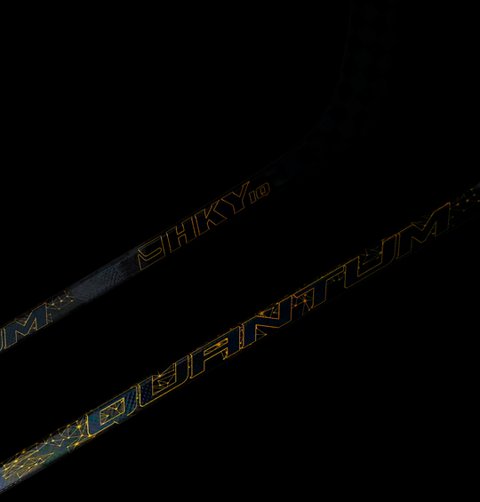 HKY IQ Quantum hockey stick with 24K carbon fiber weave on dark background
